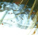 Have your hand dyed mosquito net custom-decorated with sequins, beads, bells, and diamantes...