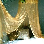 Hand dyed mosquito nets, for a sense of fantasy - decorated with sequins, beads, bells, and diamantes...