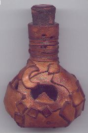 Small Elixur Bottle covered with patchwork bucskin and decorative cork - Click to view larger image